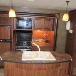 Inside travel trailer view of kitchen