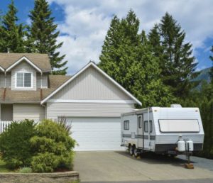 Single Camper trailer in Driveway