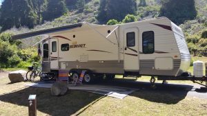 Travel trailer set up at Plaskett Creek Campground near Big Sur California