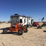 RV Rental in desert with ATV's in Sand