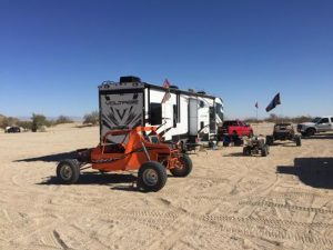 RV Rental in desert with ATV's in Sand