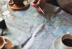 person looking at a map and planning an RV vacation