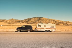 RV rental hooked up to a truck in the desert