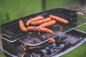 sausages cooking on a grill