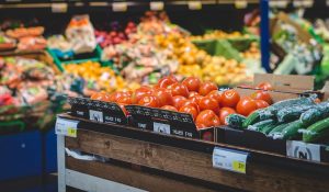 tomatoes in a grocery store produce section