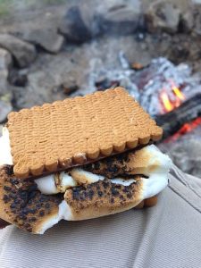 s'mores next to a campfire