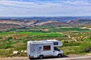 white RV camping in the wilderness