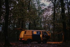 RV camping in the woods at night