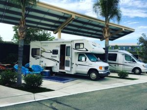 two RVs parked side by side