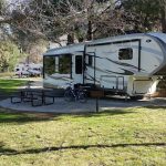 Cardinal Forest River RV parked at a campground