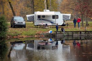 family RV camping in a pop-up camper