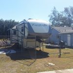 RV set up at side of home