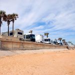 row of RV camping by the beach