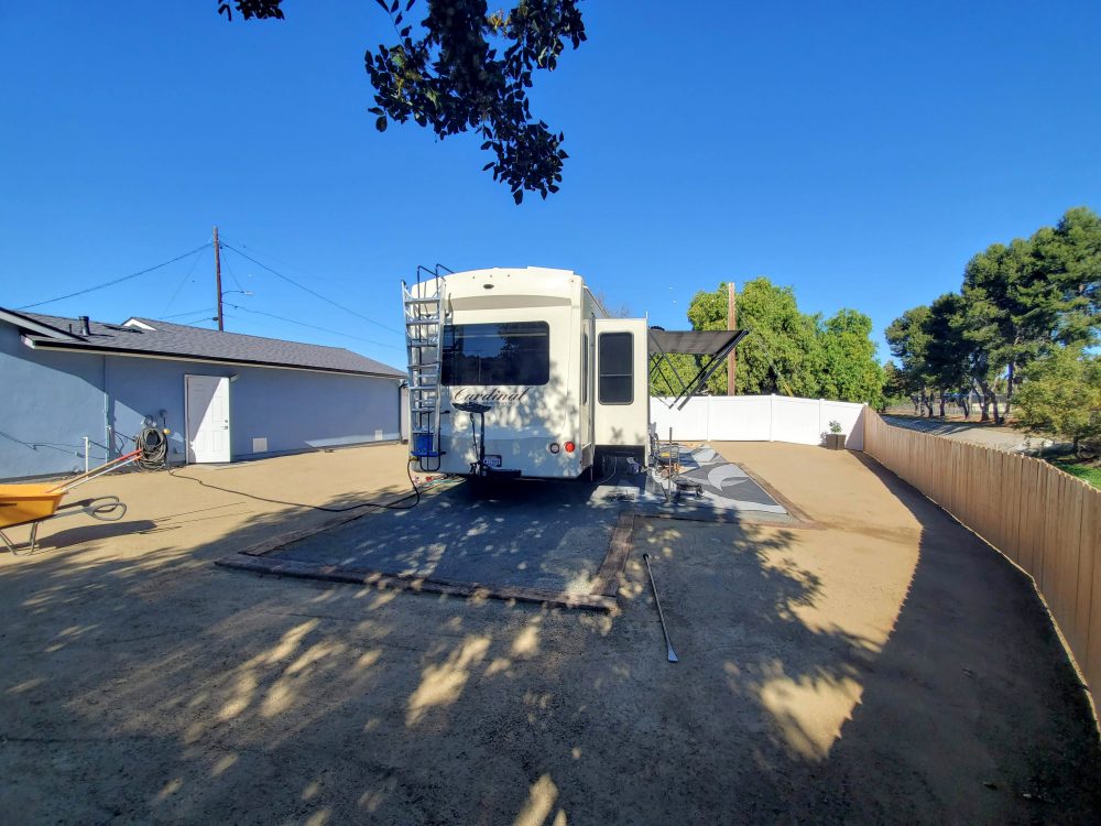 RV set up on RV Pad - Side of Home